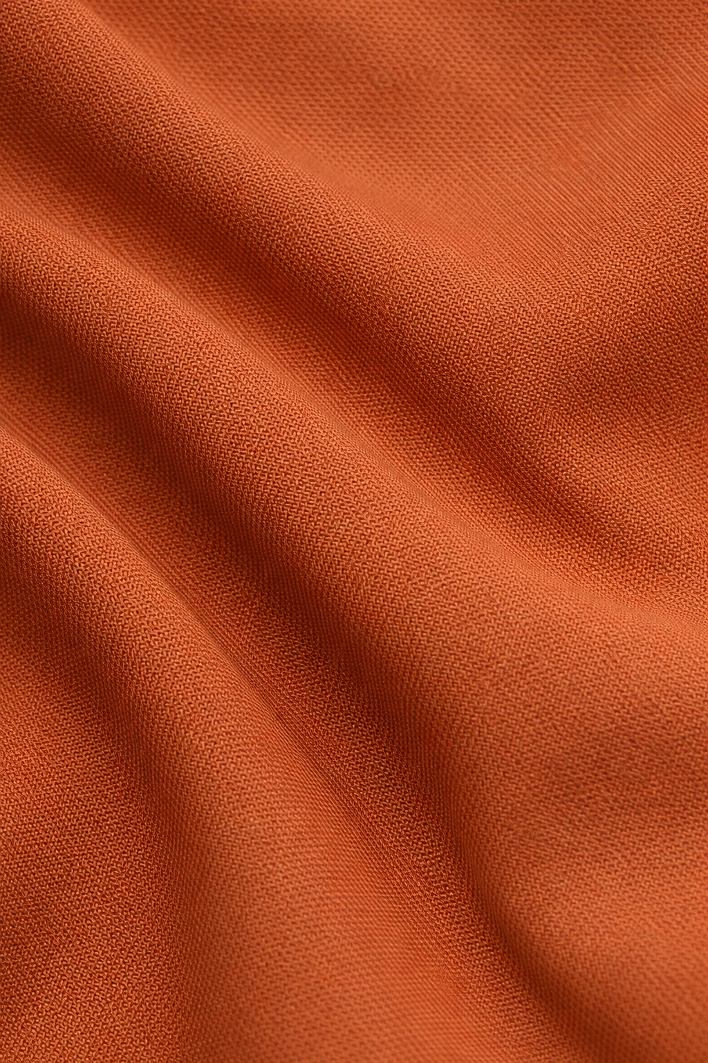 Close-up van de soepel vallende stof van het broekpak