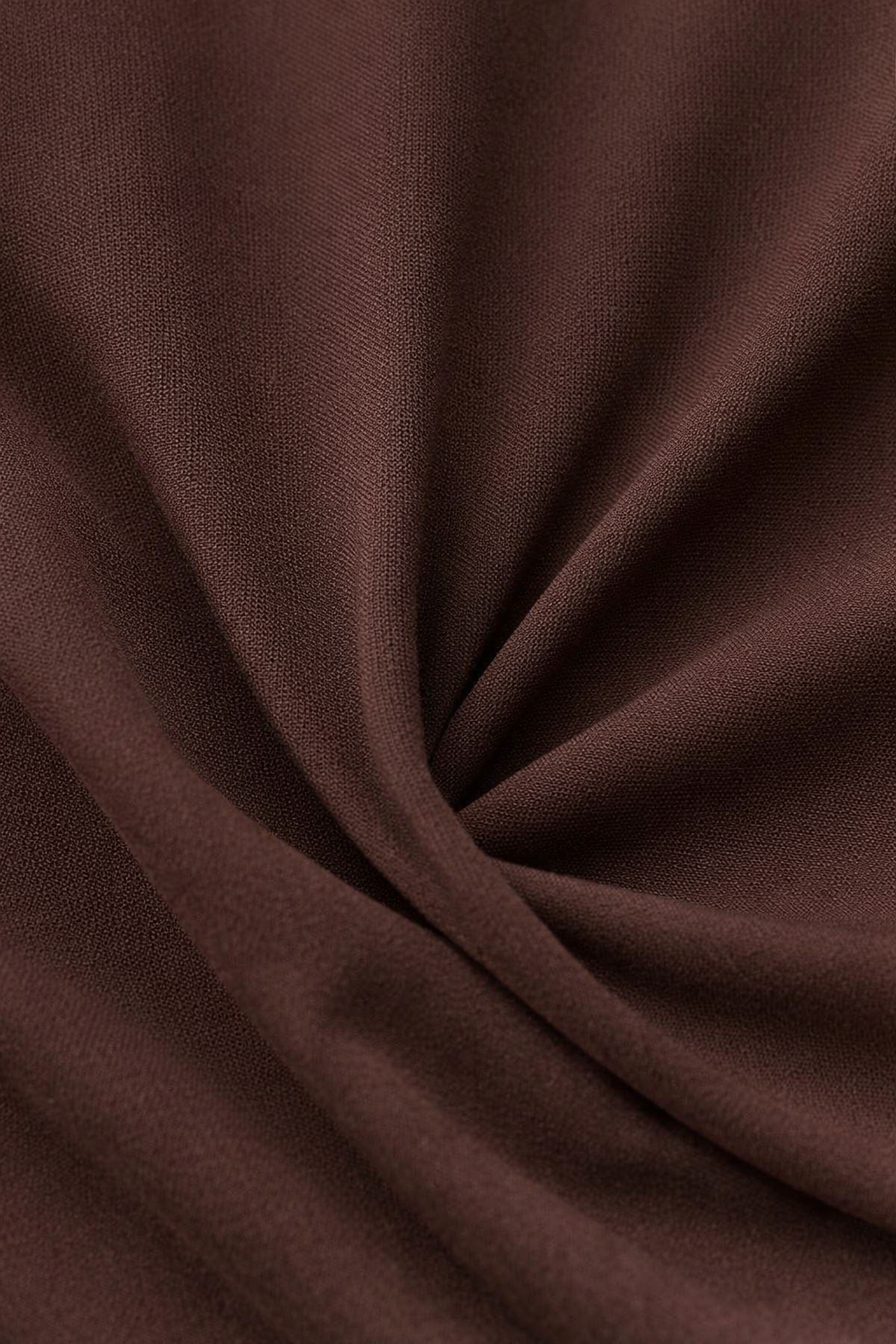 Close-up van de soepele tricotstof van het T-shirt