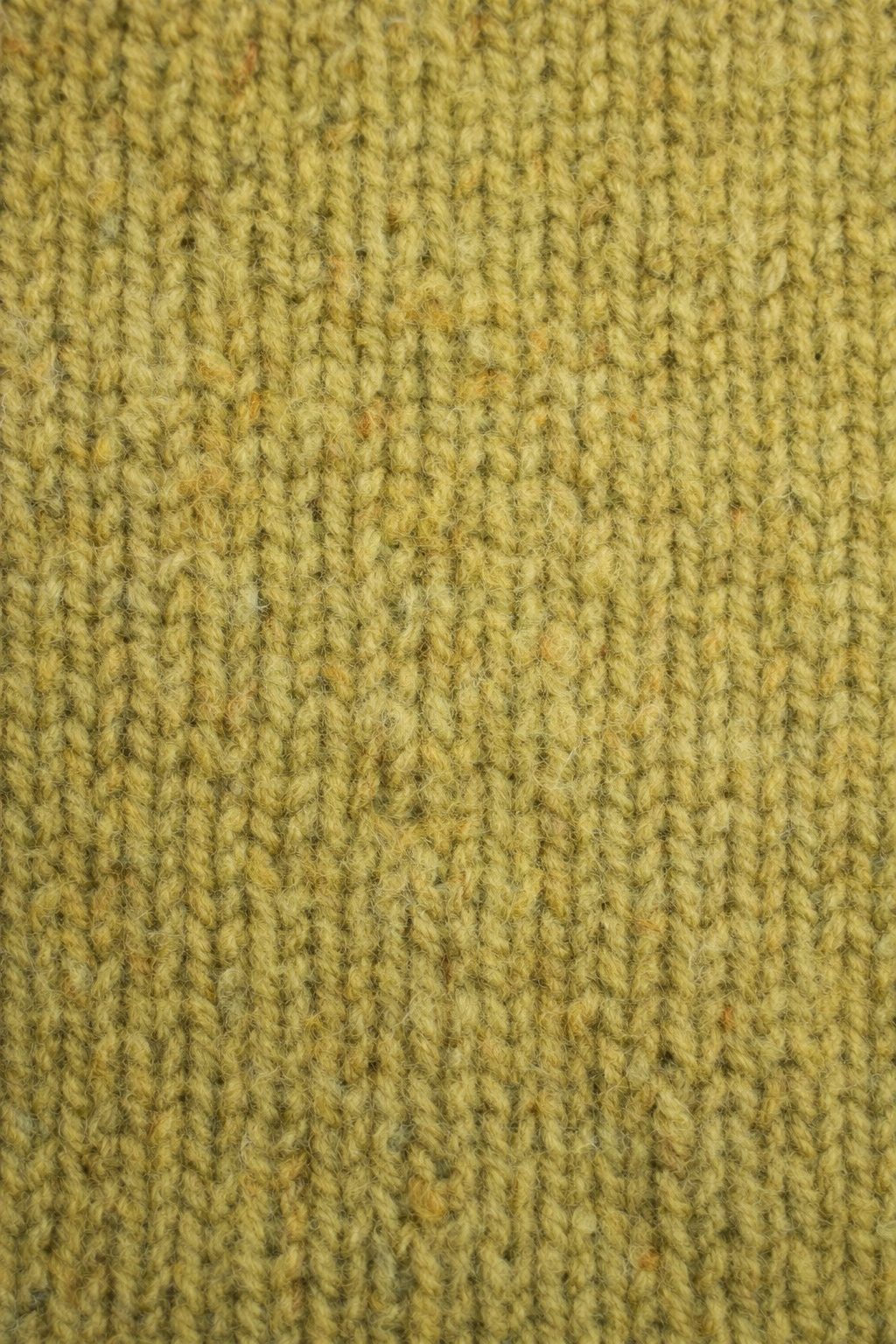 Close-up van de grove breisteek van de trui
