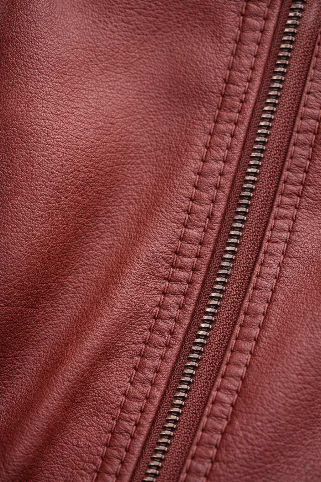 Close-up van de leerlook stof en de rits van het jasje